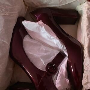 Patten leather red shoes in size 10 in great condition.